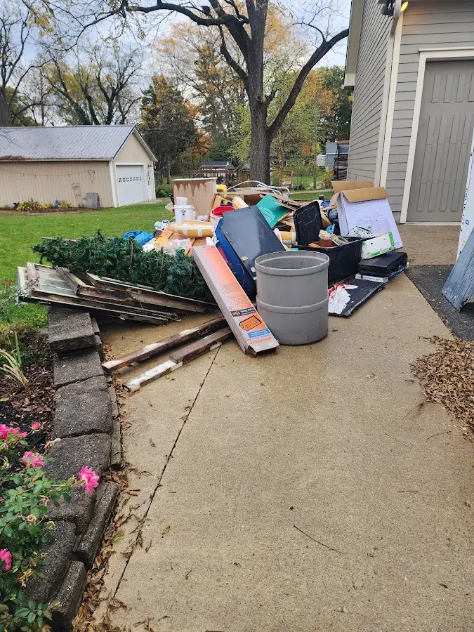 Dumpster being loaded with debris for 10 Yard Dumpster Rental in Los Alamitos